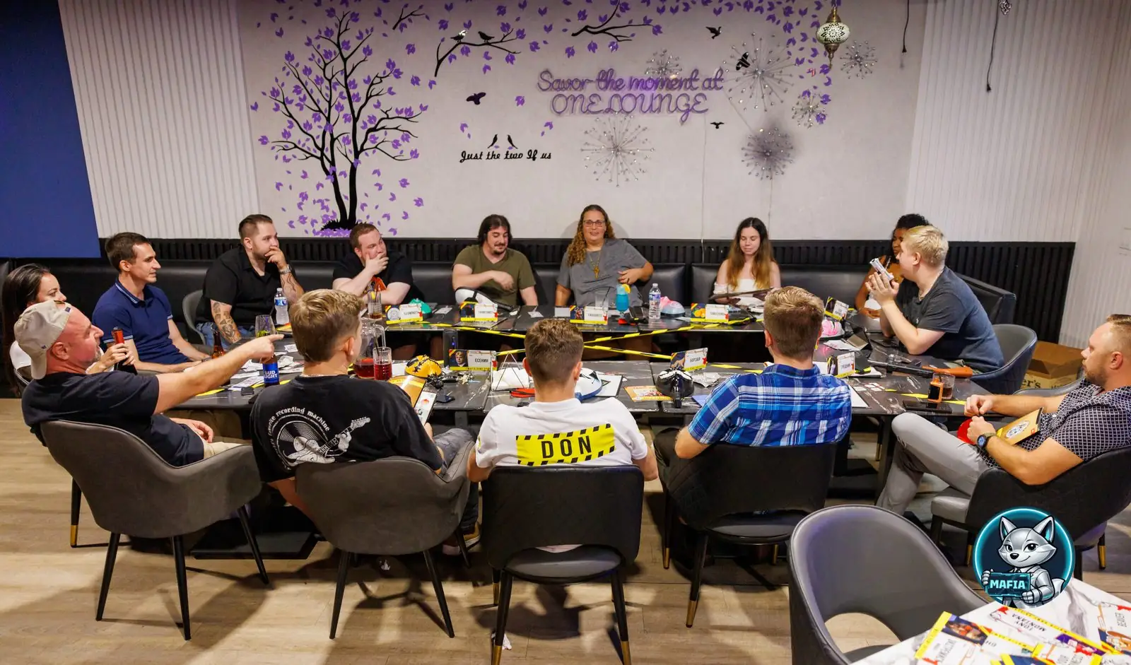 A full table of players mid-game at a Mafia Orlando night